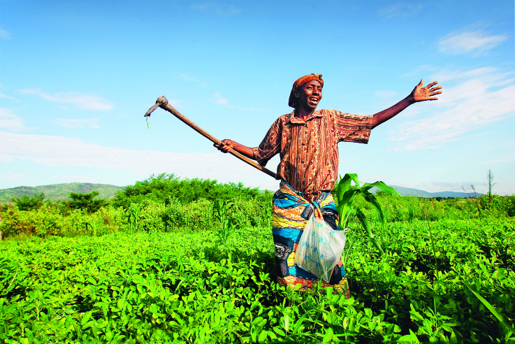 on their small farm at Mwandiga, near Baraka WFW women work.